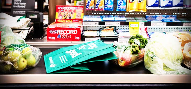 grocery items on a supermarket conveyor belt