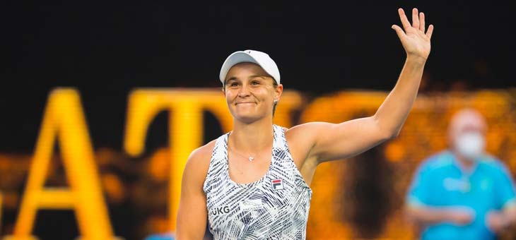 ash barty waves to the crowd after winning a match