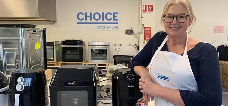 choice expert standing in front of air fryers